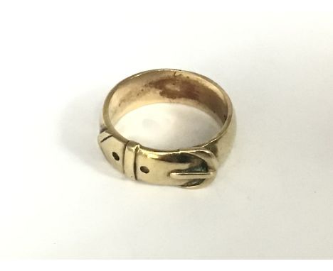 A heavy 9ct gold buckle design ring, Size V, approx 9g. (A).