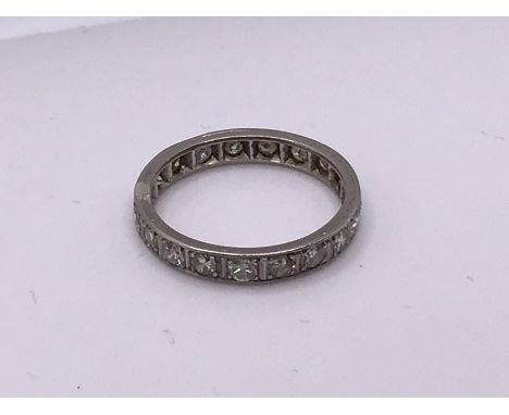 A white gold and diamond full eternity ring. Size M, (A).