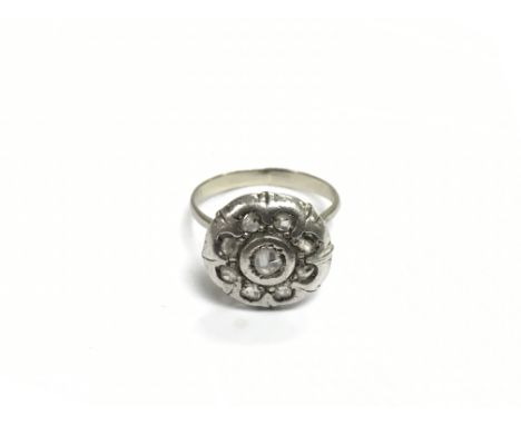 A white metal multi stone diamond ring, approx 2.8g and approx size L-M.