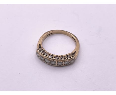 9ct gold 7 stone diamond 1/2 loop ring. (.2ct). Size K 1/2, 2.2gm. (A)