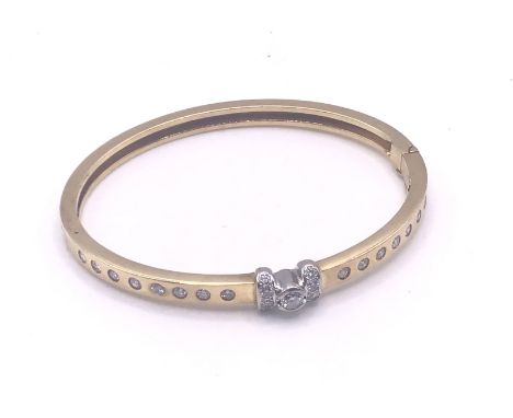 A 18ct gold diamond set bangle, approximately 23g.