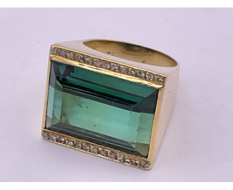 A large 18ct gold faceted green tourmaline and diamond dress ring, approx 18.9g, M. (A).