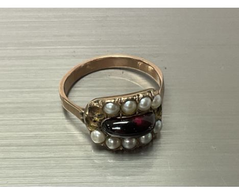 A min 9ct gold antique cabochon garnet and seed Pearl ring, engraved and dated 1816. P.