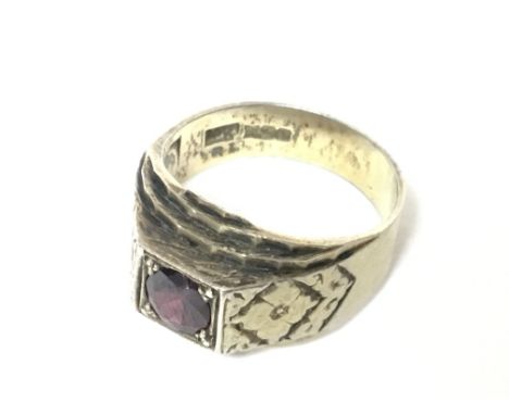 A silver gilt ring set with a red stone NO RESERVE