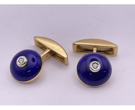 A pair of 18ct yellow gold and blue guilloche enamel cufflinks each inset with a small central diamond. Approximately 15g.