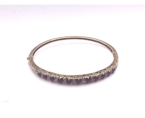 9ct gold ruby/diamond bangle, approx 10g. (A).