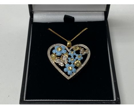 A Royal Mint issued heart design pendant with floral enamel and stone design.