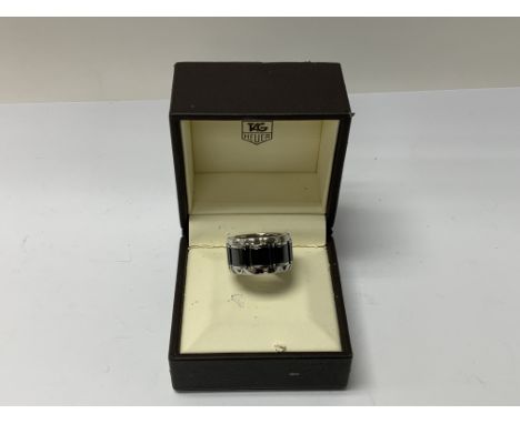 A Ladies Tag Hebert stainless steel and ceramic ring set with a 0.07ct diamond, Size M, (B)