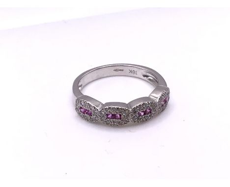 An 18ct white gold diamond and pink sapphire ring, size L, (A).