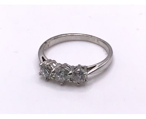 An 18ct white gold and 3 stone diamond ring, 1ct total, Size O, (A).