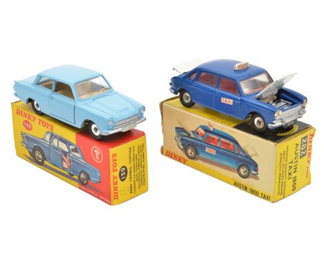 2 Dinky Toys. Ford Cortina (139) in light blue with cream interior. Plus an Austin 1800 Taxi (282) in dark blue with white bo