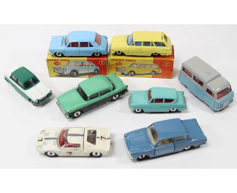 8 Dinky Toys. A scarce Humber Hawk in light green with black lower sides. A part boxed Morris 1100 in light blue and a part b