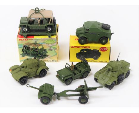 7 Dinky Military. Field Artillery Tractor (688), late example with plastic wheel hubs. Plus an Austin Para-Moke on sled (601)