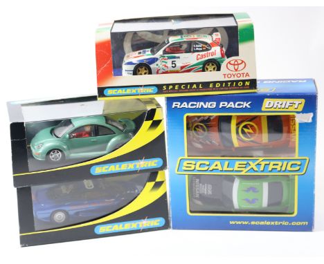 5 2000's issue Scalextric slot racing cars. A 'Promotional Item Not For Resale' Jaguar XJ220 in dark metallic blue, an unusua