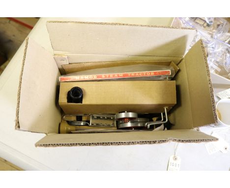 A Mamod live steam Steam tractor. A single cylinder fuel pellet fired traction engine with whistle. Boxed as new, minor wear.