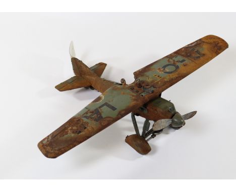 A scarce Tipp &amp; Co. tinplate German aircraft. A late 1930's monoplane light bomber with wind-up propeller linked to wheel