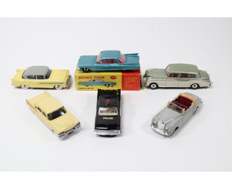 6 Dinky Toys. Cadillac 62 (147) in metallic green with red interior in a worn/damaged box. Plus a Dodge Royal Sedan in cream 