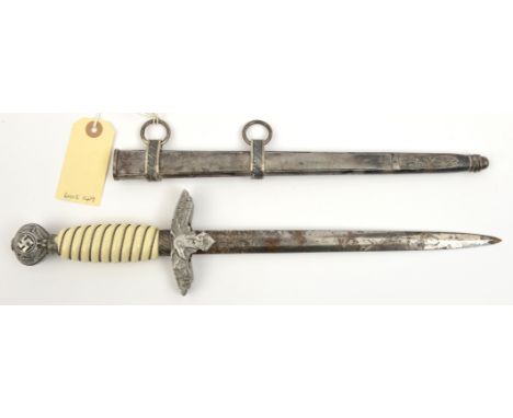 A Third Reich 2nd pattern Luftwaffe officers’ dagger, in its scabbard. QGC (the blade and hilt heavily corroded, the grip a m