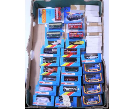 44x Matchbox vehicles. Including; 24x 1980s Matchbox in blue window boxes/blue card blister packs - London bus, Jaguar XK120,