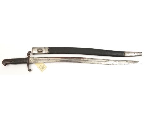 An 1856 pattern yataghan sword bayonet, 23” wavy blade with Govt proof marks and King’s head mark. Chequered leather grips, p