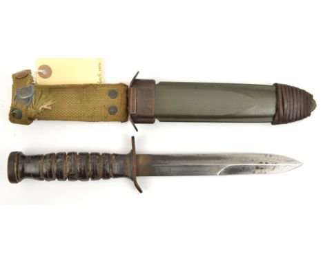 A WWII US M3 trench knife, blade 8¾”, DE at point, marked in capitals along one edge “US M3” and maker’s name “Case”, ribbed 