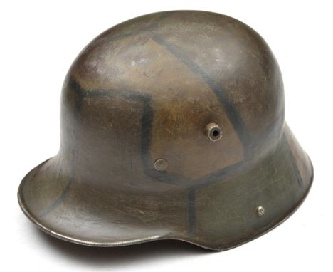 A German M16 steel helmet,  the skull camouflage painted at a later date, with worn leather lining. Generally GC (the inside 