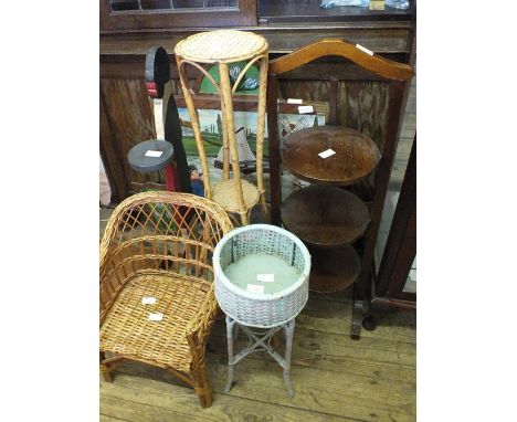 A folding cake stand, a dumb waiter, a painted firescreen and a painted wicker plant stand