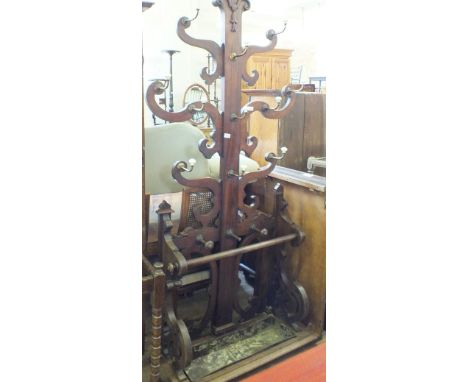A Victorian Mahogany tree hall stand with brass and ceramic hooks