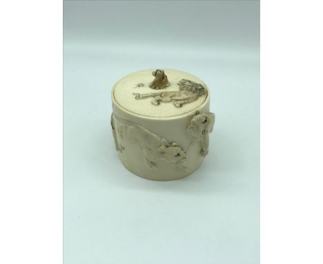 Japanese Meiji period ivory carved trinket box, styled with Lion & Lioness carvings, signed by the artist. 