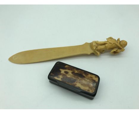 A Victorian Ivory letter opener styled with small carved musician together with Victorian snuff box 