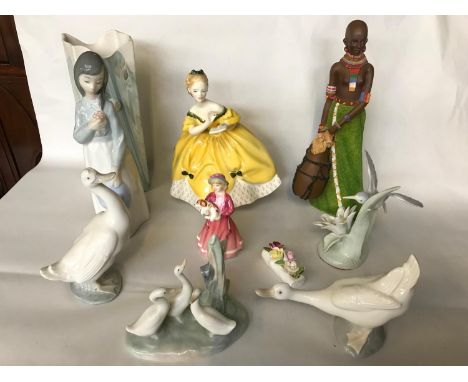 A mixed lot of porcelain figurines to include names; 'Royal Doulton' and 'Nao' 