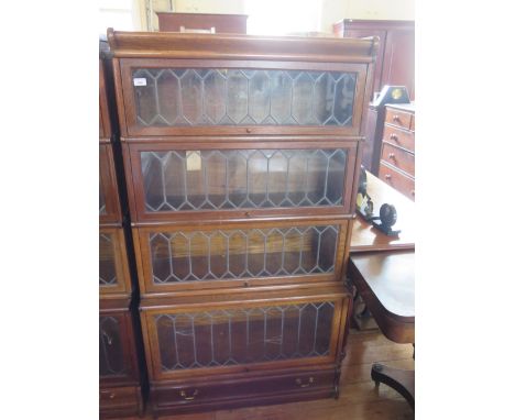 A Globe Wernicke Oak Four Tier Leaded and Glazed Bookcase