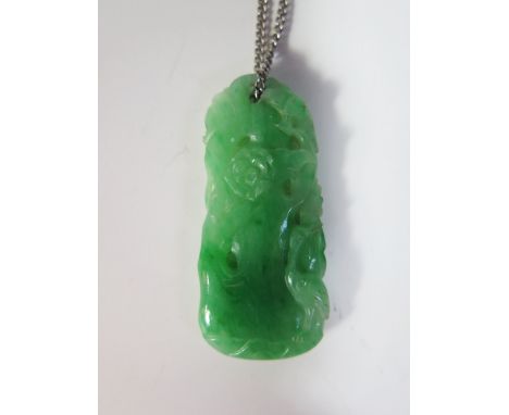 A Chinese Carved Jade Pendant decorated with birds and foliage, 45 mm drop, on white metal chain