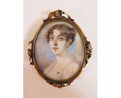 An Early Nineteenth Century Miniature Portrait on Ivory in original brooch frame