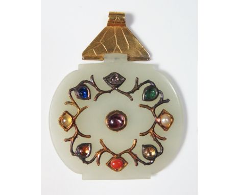 A Chinese Carved Jade Precious and Semi-Precious Stone Inlaid Pendant, the back decorated with a flower and hanging from yell