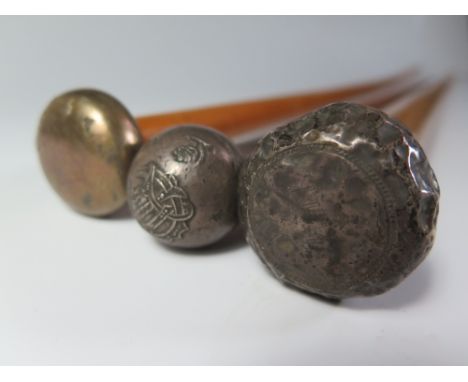A Chinese Silver Finial Walking Cane and two others