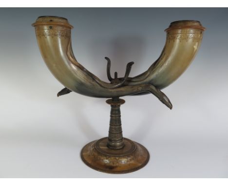 An Unusual Pressed Horn Candelabra with incised decoration and twin cobras rising centrally, 33.5 cm high