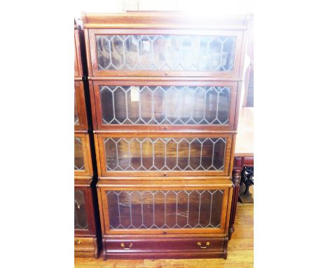 A Globe Wernicke Oak Four Tier Leaded and Glazed Bookcase