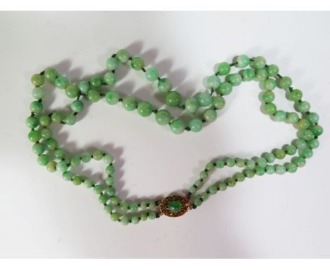 A Jade Bead Double Strand Necklace with 14K gold clasp, 44 cm, 58.7 g
