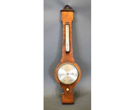 A 19th Century Burr Walnut Wheel Barometer Thermometer, the silver dial inscribed M. Hughes London 100 cms long 