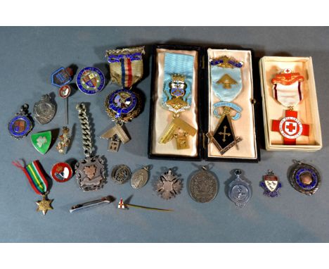 A Silver Gilt and Enamel Masonic Jewel together with two other similar silver Masonic jewels and various medallions and relat