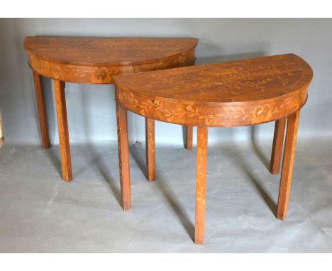 A Pair of 19th Century Marquetry Inlaid Demi-Lune Console Tables, the crossbanded and inlaid tops above similar friezes raise