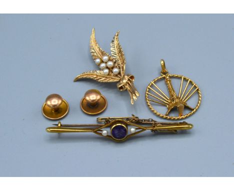 A 15ct. Gold Bar Brooch set amethyst flanked by pearls 2.8 gms together with a 9ct. gold pendant and a 9ct. gold brooch set p
