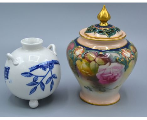 A Royal Worcester Bulbous Shaped Squat Vase decorated in blue and white in the Oriental style together with another Royal Wor