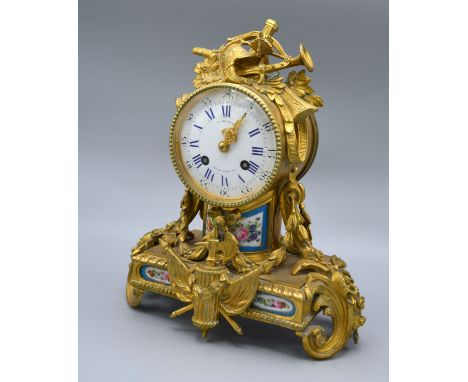 A 19th Century French Ormolu Mantle Clock, the enamel dial with Roman and Arabic numerals and inscribed S. Devaulx and with t