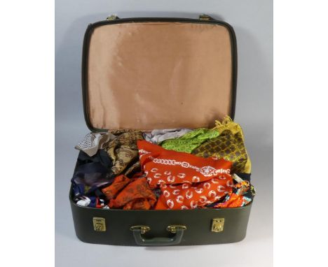 A Vintage Suitcase Containing Silk Scarves and Other Linens 