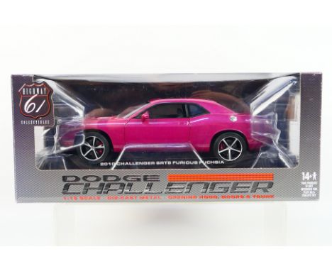 Highway 61 - A boxed 1:18 scale 2010 Dodge Challenger SRT8 in Furious Fuchsia # 50857. The model appears Mint in a Good box w