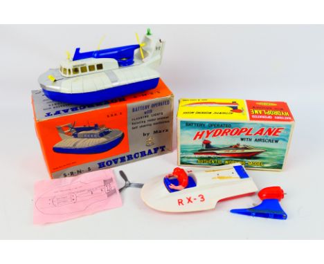 Marx - Clifford - 2 x boxed battery powered models, a Hydroplane and an S.R.N.5 Hovercraft. They appear in Fair to Good condi