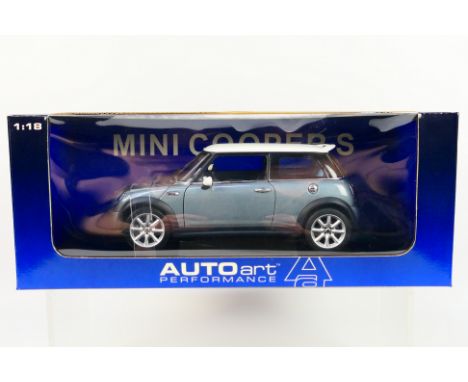 Autoart - A boxed 1:18 scale Mini Cooper S in dark silver # 74842. The car is lightly dusty from display and one windscreen w