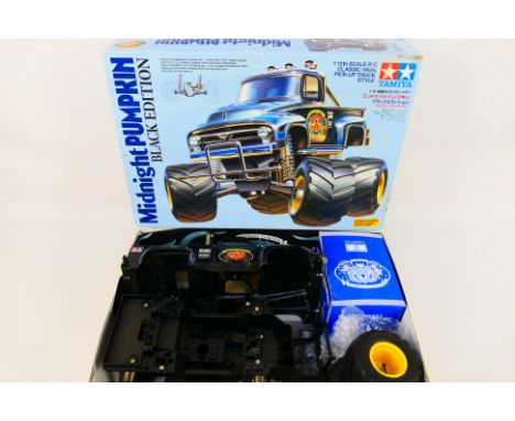 Tamiya - A boxed Tamiya #58547 1:12 scale Classic 1950's Pick-Up Truck Style 'Midnight Pumpkin - Black Edition'. The model is